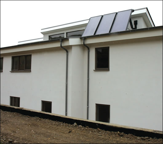 Hot water is partially supplied by six square metres of Gasokol solar panels supplied by Universal Solar, with an electric immersion as back-up Hot water is partially supplied by six square metres of Gasokol solar panels supplied by Universal Solar, with an electric immersion as back-up