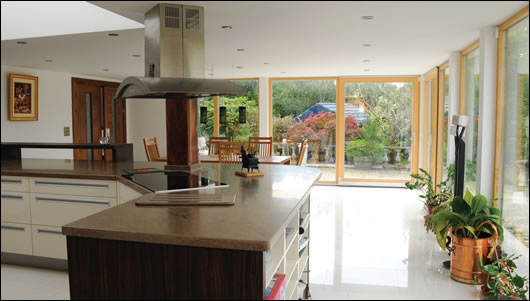 The finished open plan kitchen with energy-efficient Berbel extract hood which removes grease and recirculates warm air