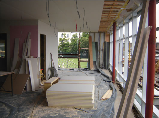 The curtain walling going up, and the ceiling showing insulated plasterboard, battening, and Siga Majpell membrane