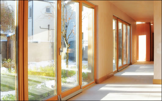 The open plan ground floor opens onto the south-facing garden. This elevation is extensively glazed to maximise solar gains