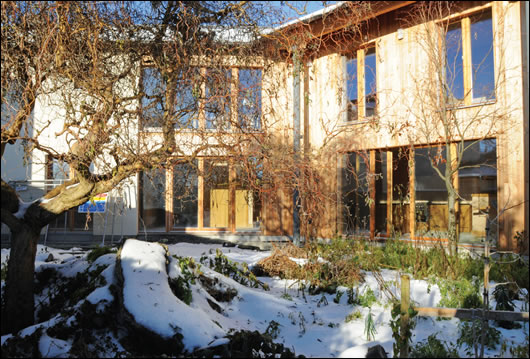 The open plan ground floor opens onto the south-facing garden. This elevation is extensively glazed to maximise solar gains