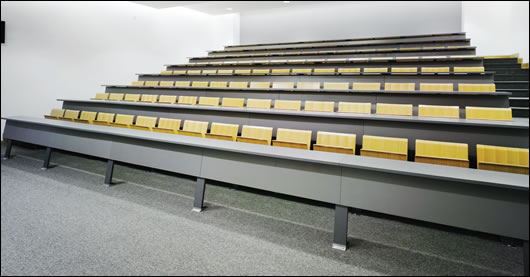 In the larger lecture theatres air is supplied through grilles in the floor, using a system that detects occupancy in the room and monitors air levels