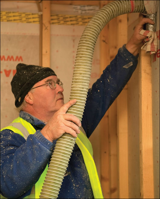 Francis Thoma of Ecocel pump-filled the walls with cellulose insulation, made in Cork from recycled paper that’s collected from a local printer Francis Thoma of Ecocel pump-filled the walls with cellulose insulation, made in Cork from recycled paper that’s collected from a local printer