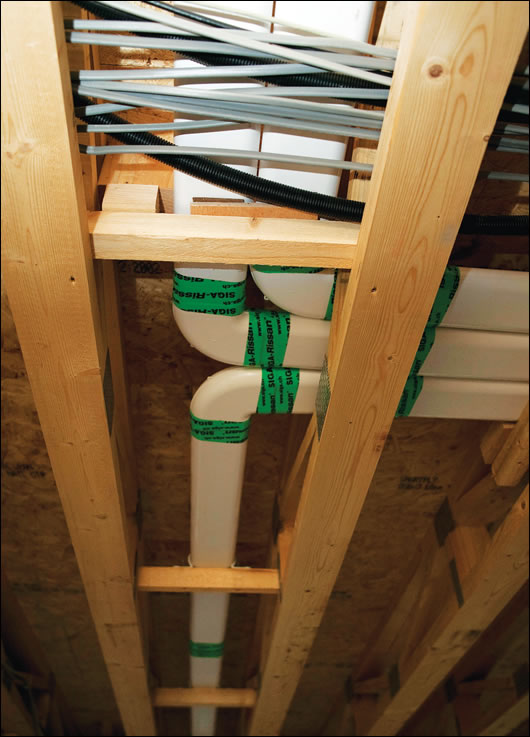 The house’s open-web floor truss system provides a clean and neat space to run services such as heat recovery ventilation duct runs and electrics The house’s open-web floor truss system provides a clean and neat space to run services such as heat recovery ventilation duct runs and electrics