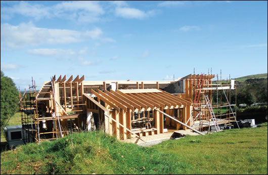 The stick built timber frame structure