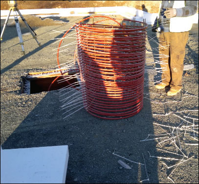 Coiled pipe for storing solar hot water in the Viking House floor slab