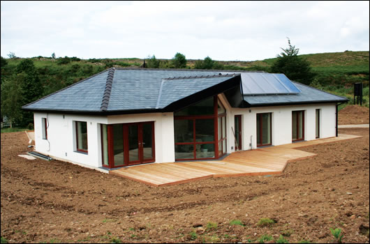 Externally insulated timber frame dwelling