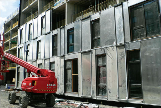 The building was constructed with GGBS concrete cross wall, stair core and floor structures, with lightweight insulated framed wall panels to all the student rooms