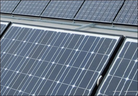 Newbridge Solar Panels Roof-mounted PV panels overlooking the shopping centre and carpark in Newbridge