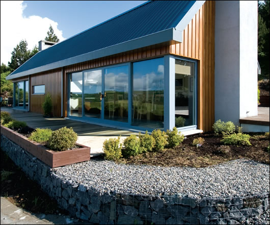 Facing south over Lough Callow, design and layout maximise both views and solar gain Facing south over Lough Callow, design and layout maximise both views and solar gain
