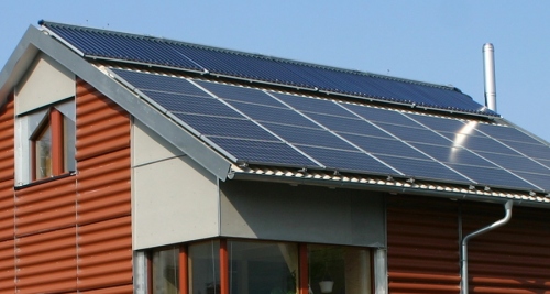 A solar photovoltaic array-clad passive house, a site that may become more familiar due to the Passive House Institute's new certification system
